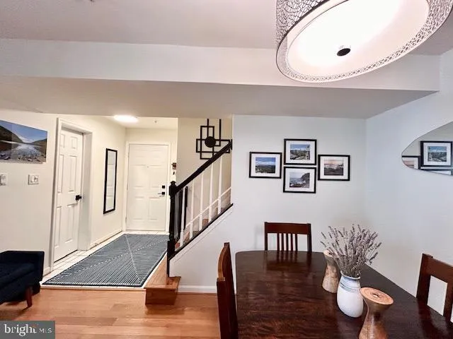 a view of a living room and kitchen with furniture