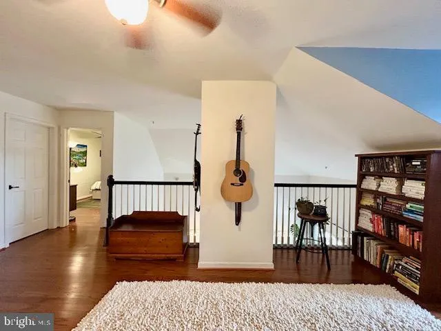 a view of living room with furniture and a rug