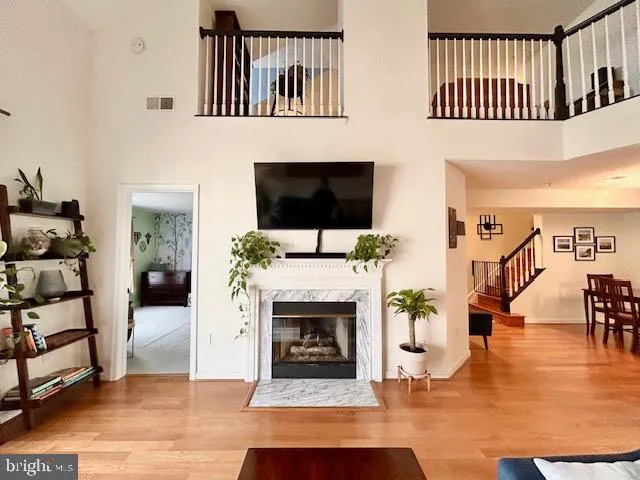 a living room with furniture rug and wooden floor