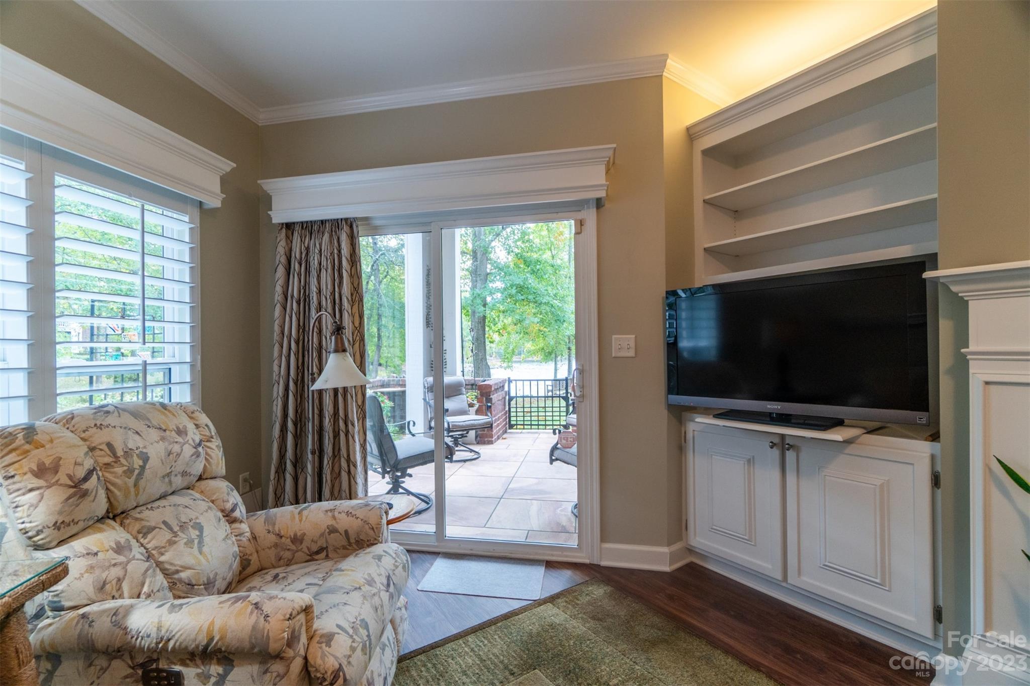 737 Peninsula Drive Davidson, NC 28036 - Photo 12 of 34 a living room with furniture and a flat screen tv