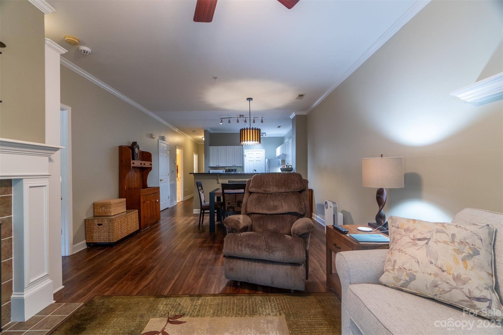 737 Peninsula Drive Davidson, NC 28036 - Photo 13 of 34 a living room with furniture and a chandelier
