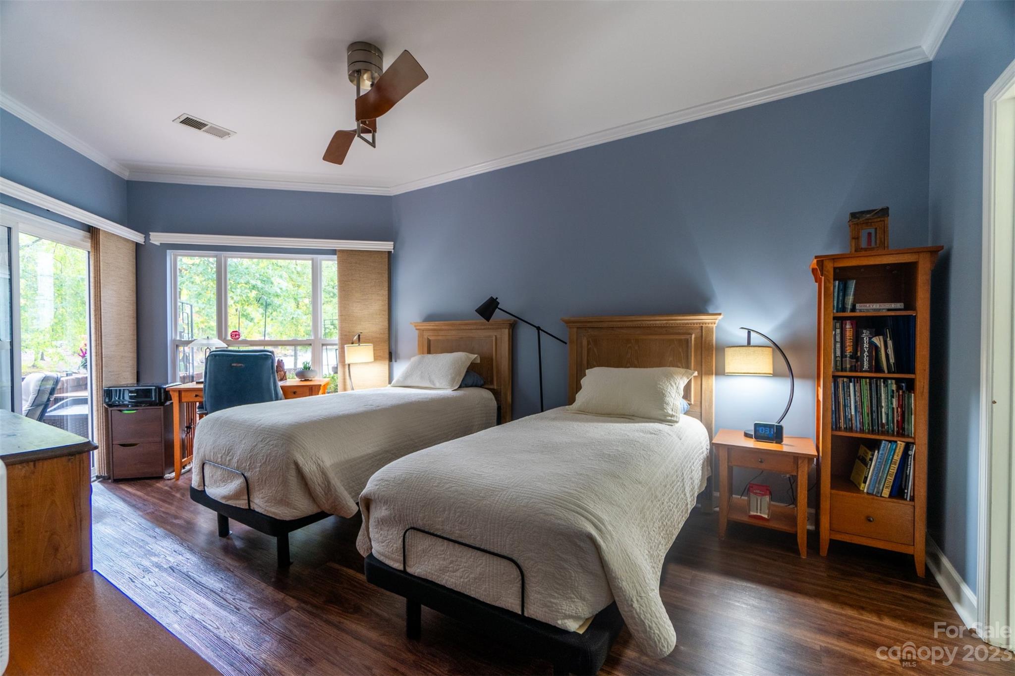 737 Peninsula Drive Davidson, NC 28036 - Photo 14 of 34 a bedroom with two beds and a chandelier