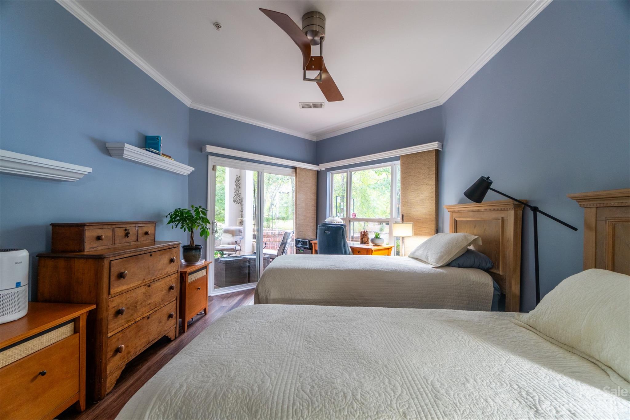 737 Peninsula Drive Davidson, NC 28036 - Photo 15 of 34 a bedroom with a bed and large windows