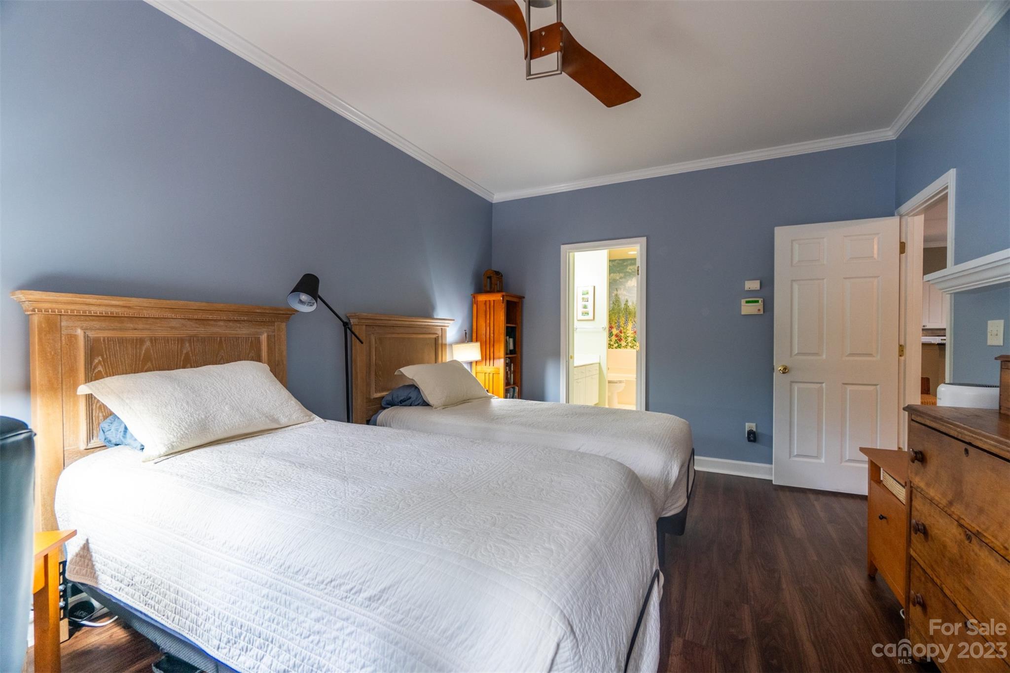 737 Peninsula Drive Davidson, NC 28036 - Photo 16 of 34 a bedroom with a bed and wooden floor