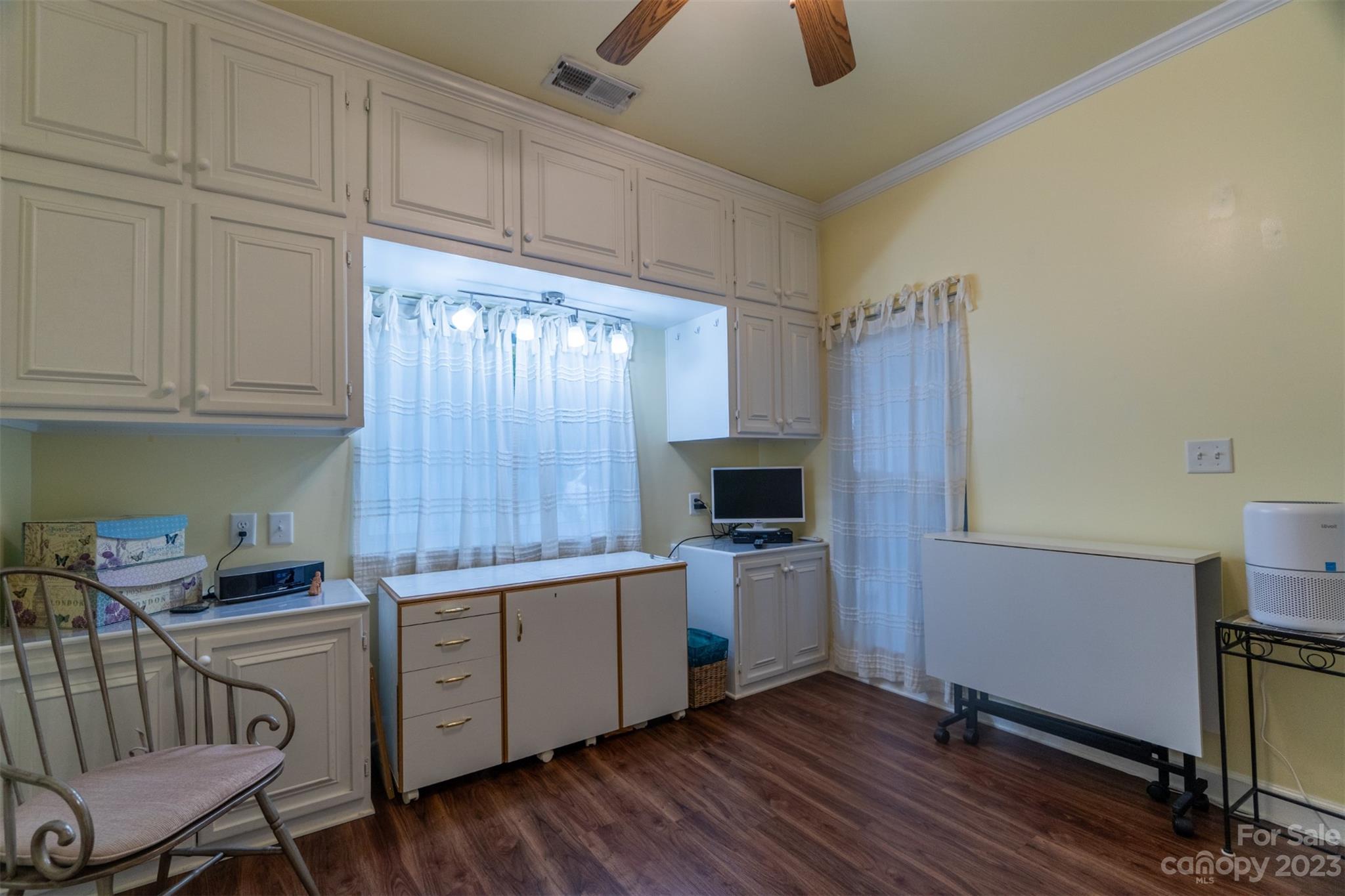 737 Peninsula Drive Davidson, NC 28036 - Photo 21 of 34 a kitchen with stainless steel appliances granite countertop a stove a sink and a refrigerator with wooden cabinets