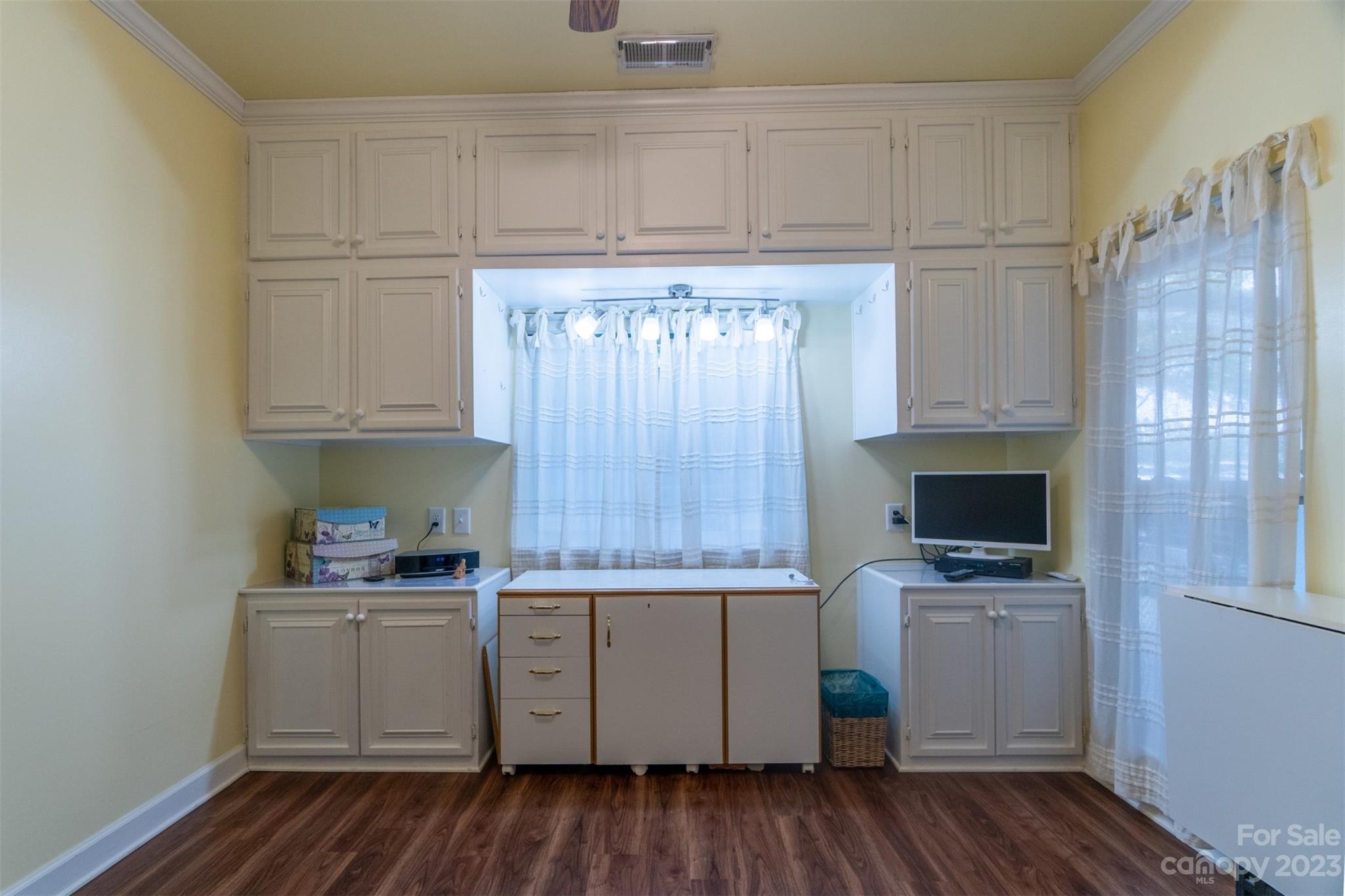 737 Peninsula Drive Davidson, NC 28036 - Photo 22 of 34 a kitchen with a sink window and cabinets