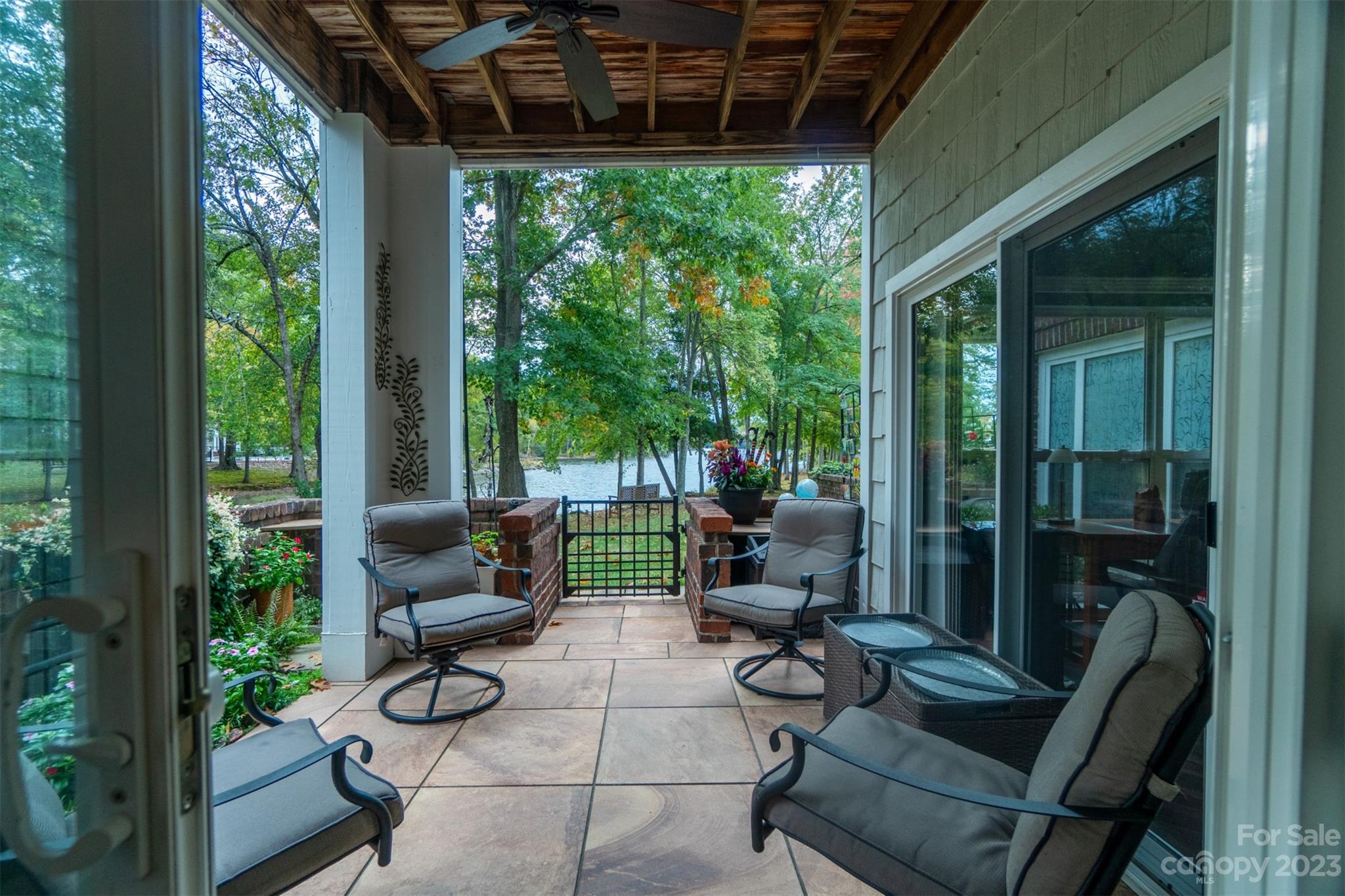 737 Peninsula Drive Davidson, NC 28036 - Photo 29 of 34 a view of a patio with couches chairs and potted plants