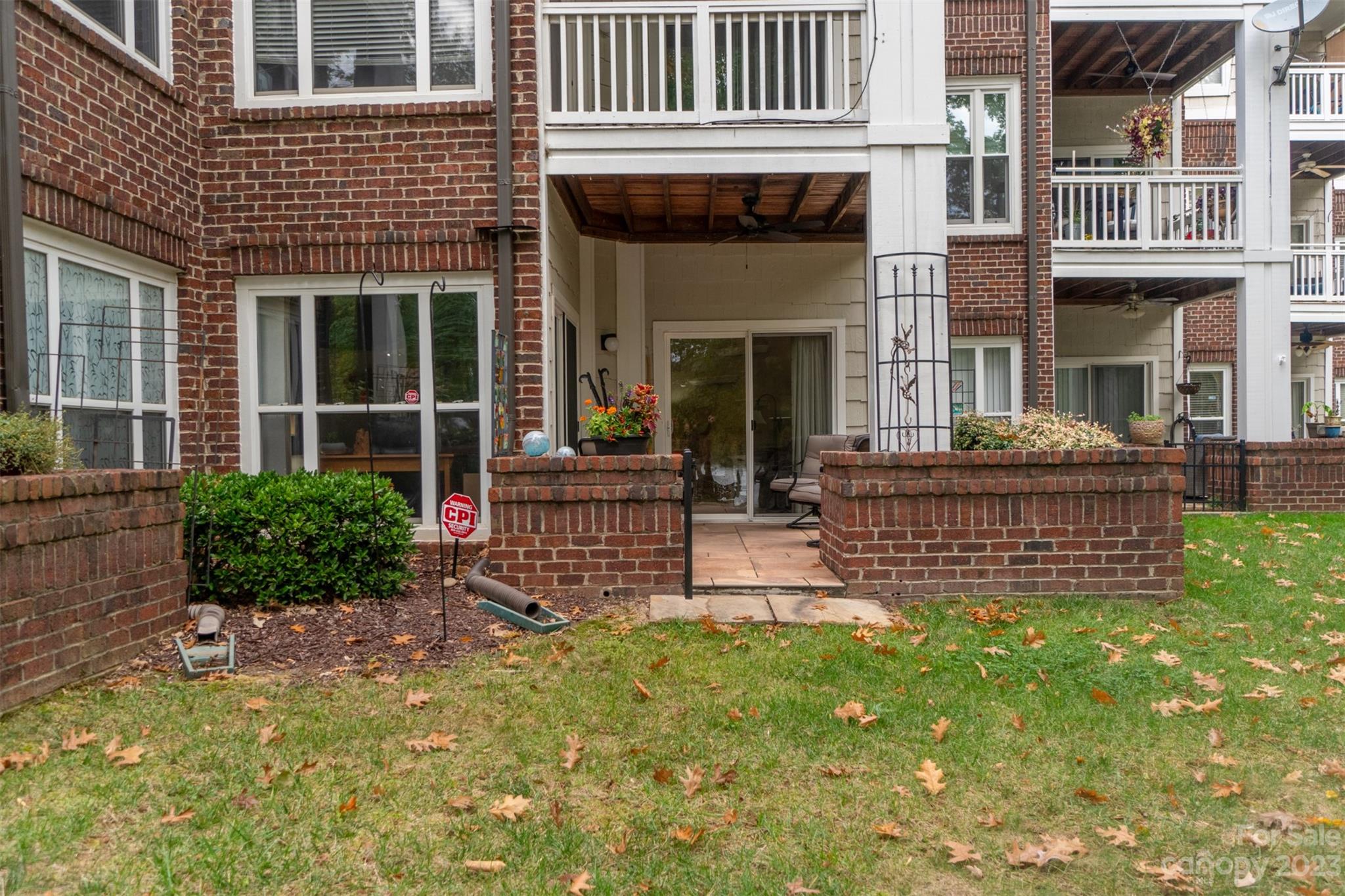 737 Peninsula Drive Davidson, NC 28036 - Photo 32 of 34 a view of a house with sitting area and garden
