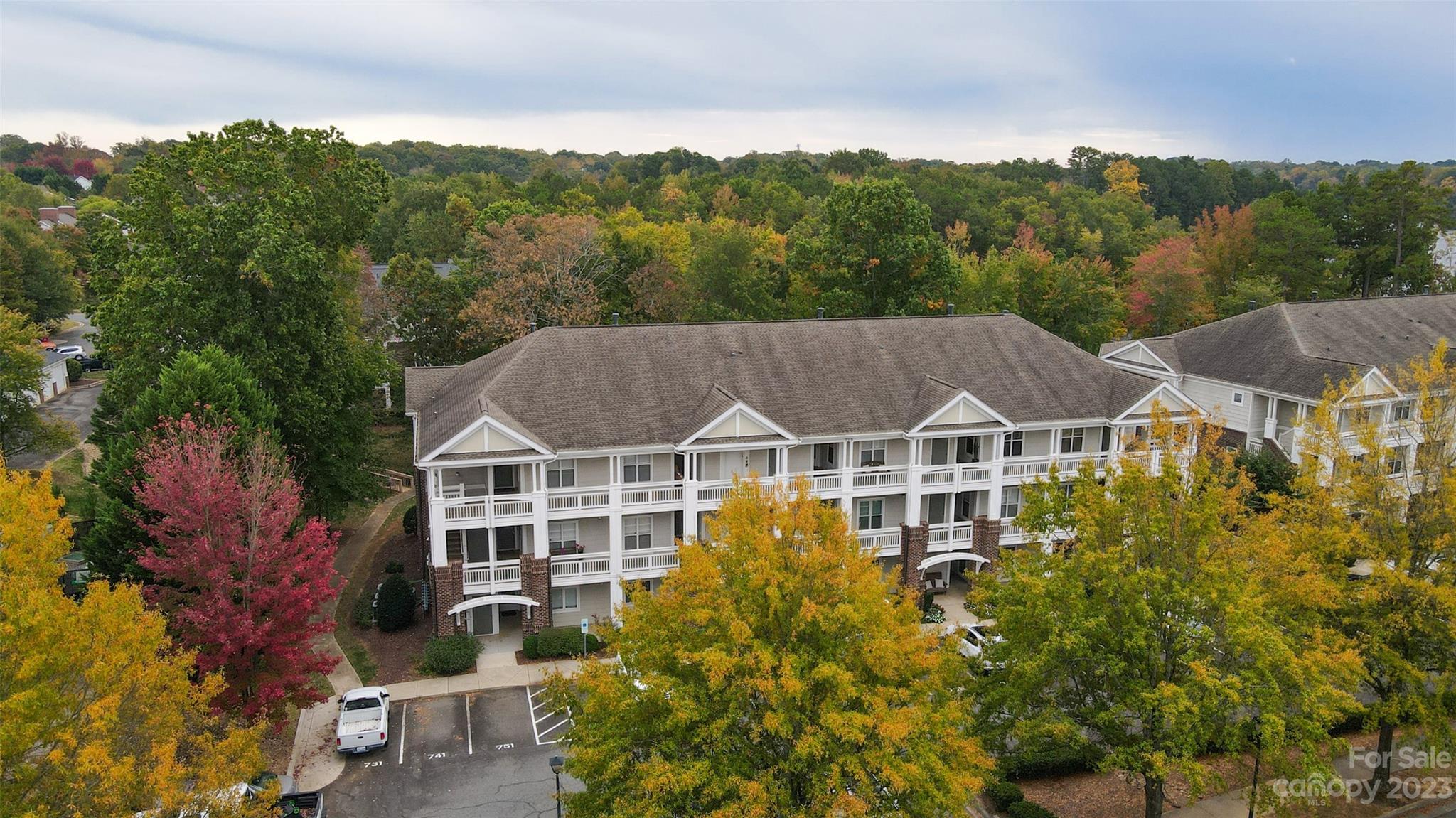 737 Peninsula Drive Davidson, NC 28036 - Photo 33 of 34 a view of a big house with big yard plants and large trees