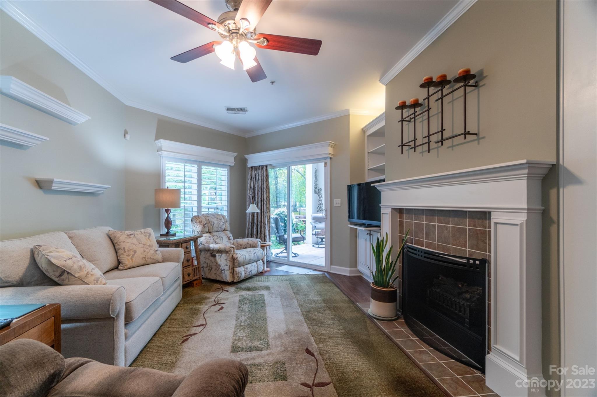 737 Peninsula Drive Davidson, NC 28036 - Photo 9 of 34 a living room with furniture and a fireplace