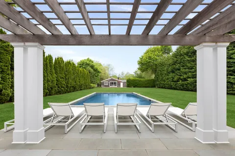 a view of swimming pool with a patio