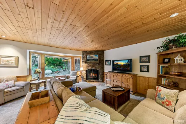 a living room with dining room and wooden floor