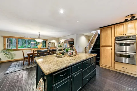 a kitchen with a table and chairs in it