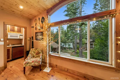 a room with wooden floor and furniture
