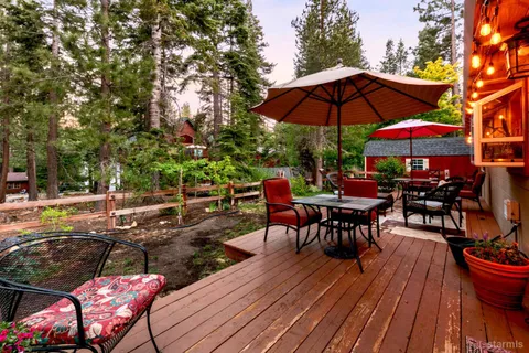 an outdoor space with furniture and umbrella