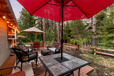 a view of a backyard with sitting area and furniture