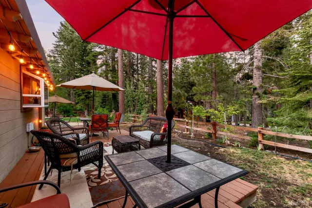 a view of a backyard with sitting area and furniture