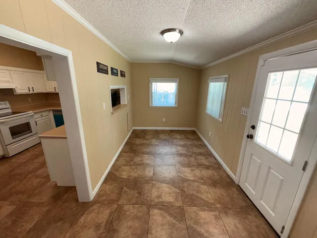 a view of a hallway with windows