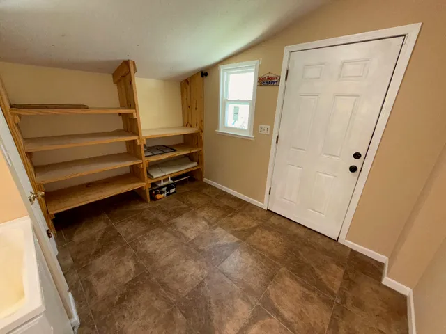 a bathroom with a toilet a sink and a shower curtain