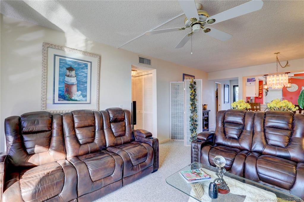 1950 Southwest Palm City Road, Unit 5306 Stuart, FL 34994 - Photo 14 of 55 a living room with furniture