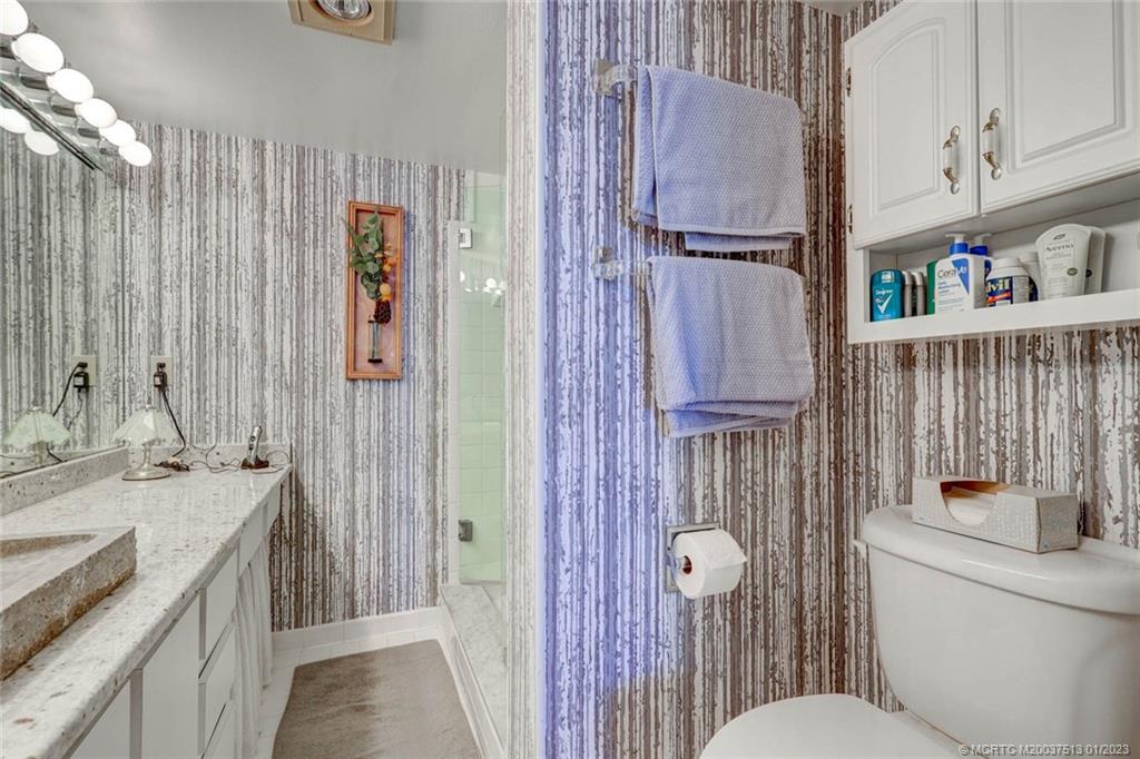 1950 Southwest Palm City Road, Unit 5306 Stuart, FL 34994 - Photo 24 of 55 a bathroom with a sink a toilet and shower