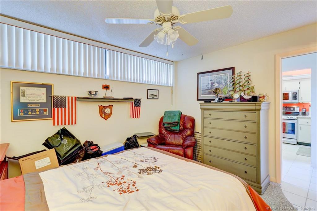 1950 Southwest Palm City Road, Unit 5306 Stuart, FL 34994 - Photo 26 of 55 a bed room with a bed and a closet