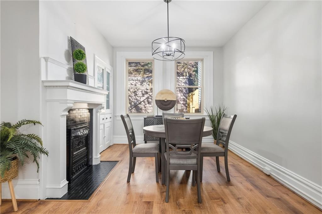 848 Grand Avenue Pittsburgh, PA 15212 - Photo 11 of 33 a view of a dining room with furniture window and wooden floor