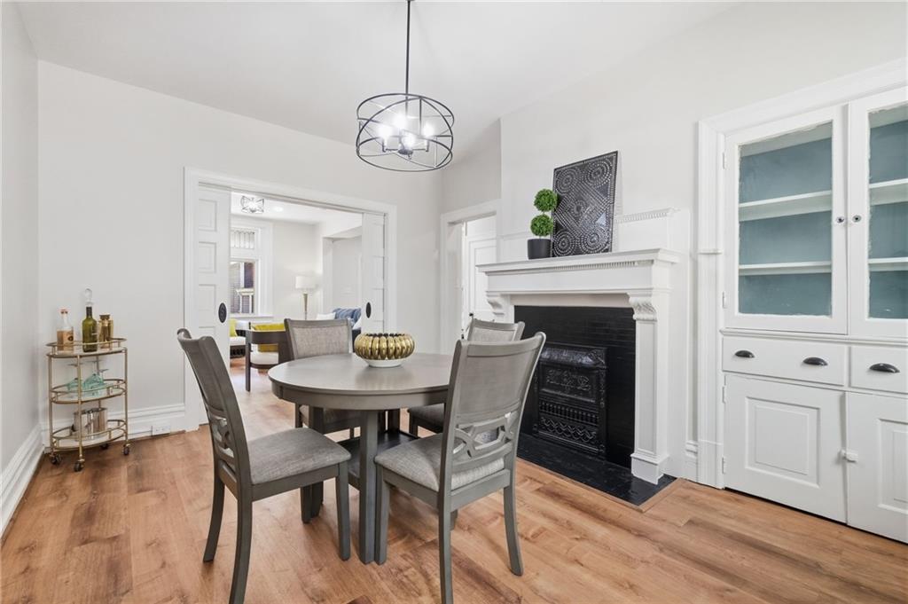 848 Grand Avenue Pittsburgh, PA 15212 - Photo 12 of 33 a view of a dining room with furniture and wooden floor