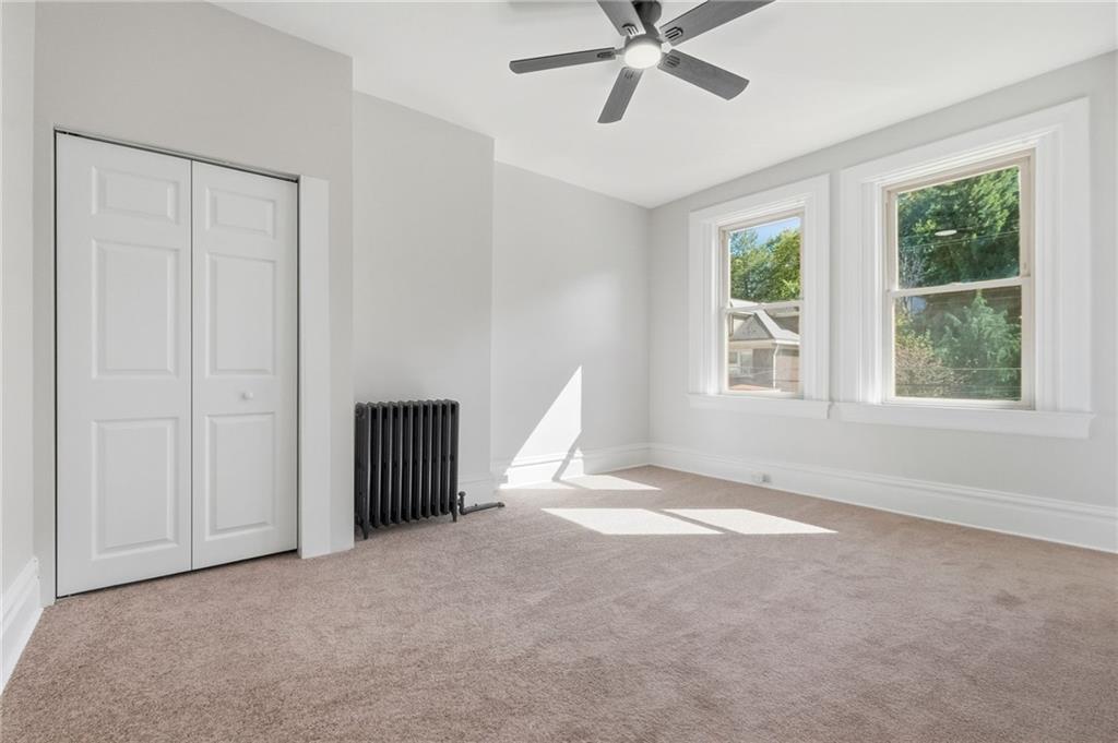 848 Grand Avenue Pittsburgh, PA 15212 - Photo 19 of 33 a view of a livingroom with a ceiling fan and window