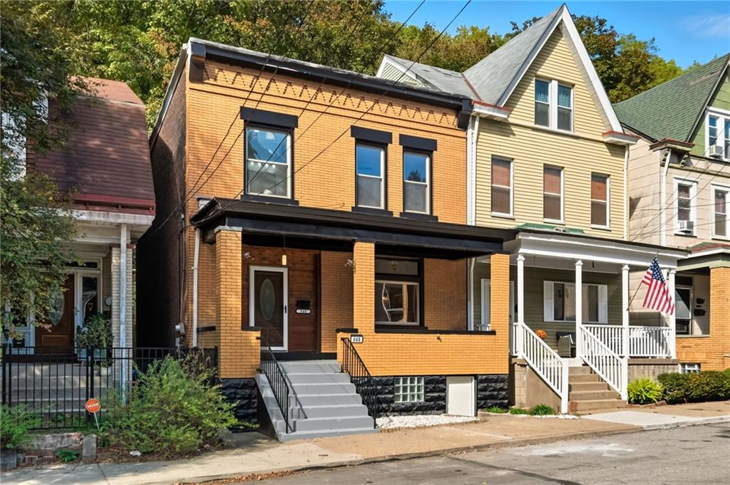 848 Grand Avenue Pittsburgh, PA 15212 - Photo 2 of 33 a front view of a house with a yard
