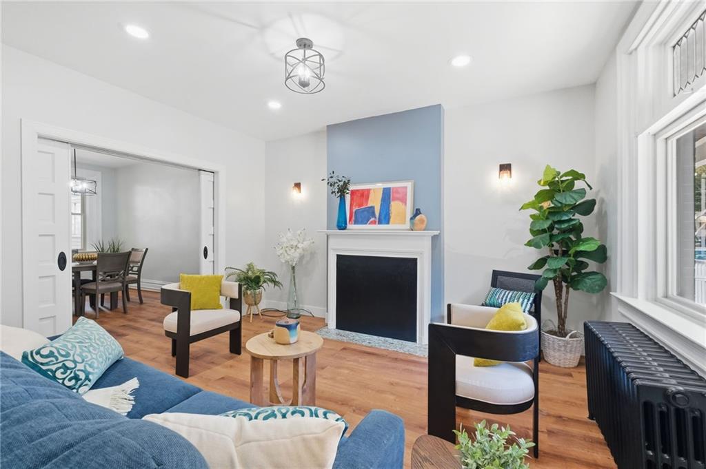 848 Grand Avenue Pittsburgh, PA 15212 - Photo 7 of 33 a living room with furniture and a fireplace