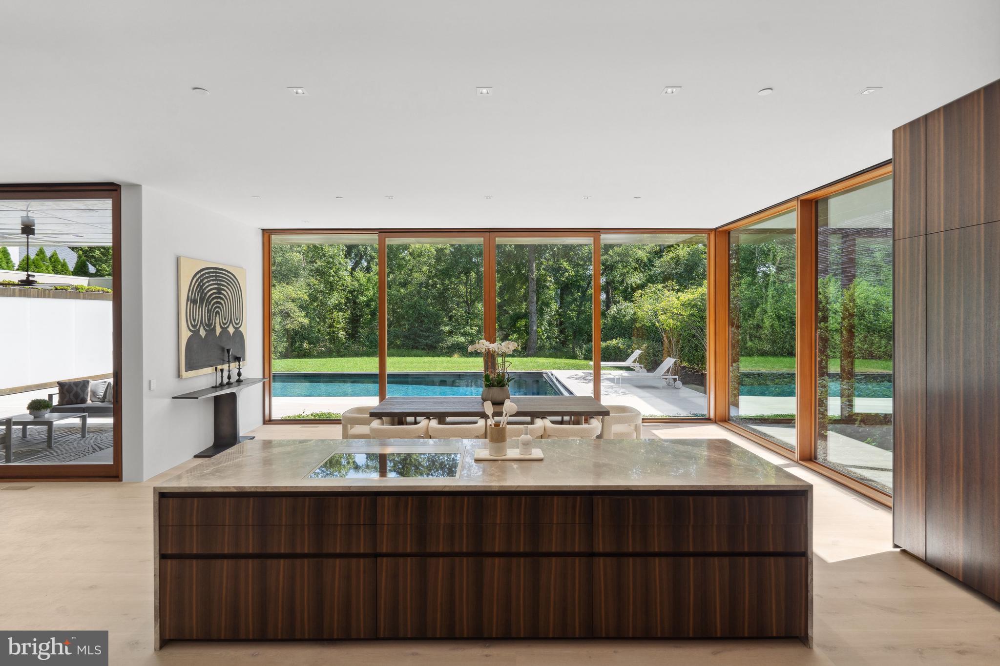 3131 Chain Bridge Road Northwest Washington, DC 20016 - Photo 13 of 54 a living room with a large window and a table