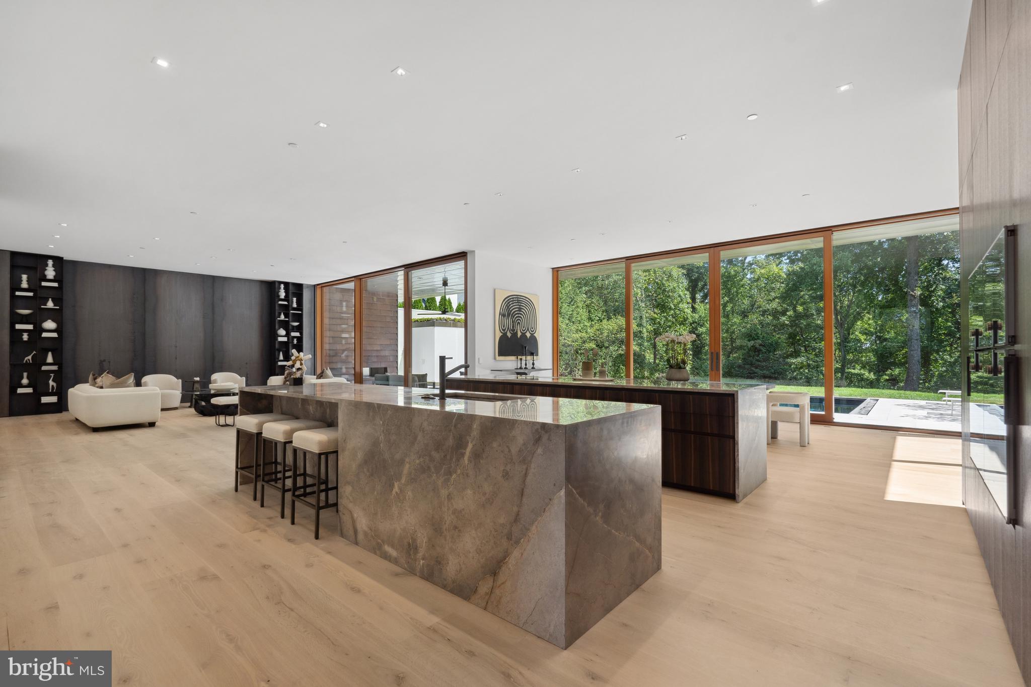3131 Chain Bridge Road Northwest Washington, DC 20016 - Photo 15 of 54 a living room with furniture and large windows