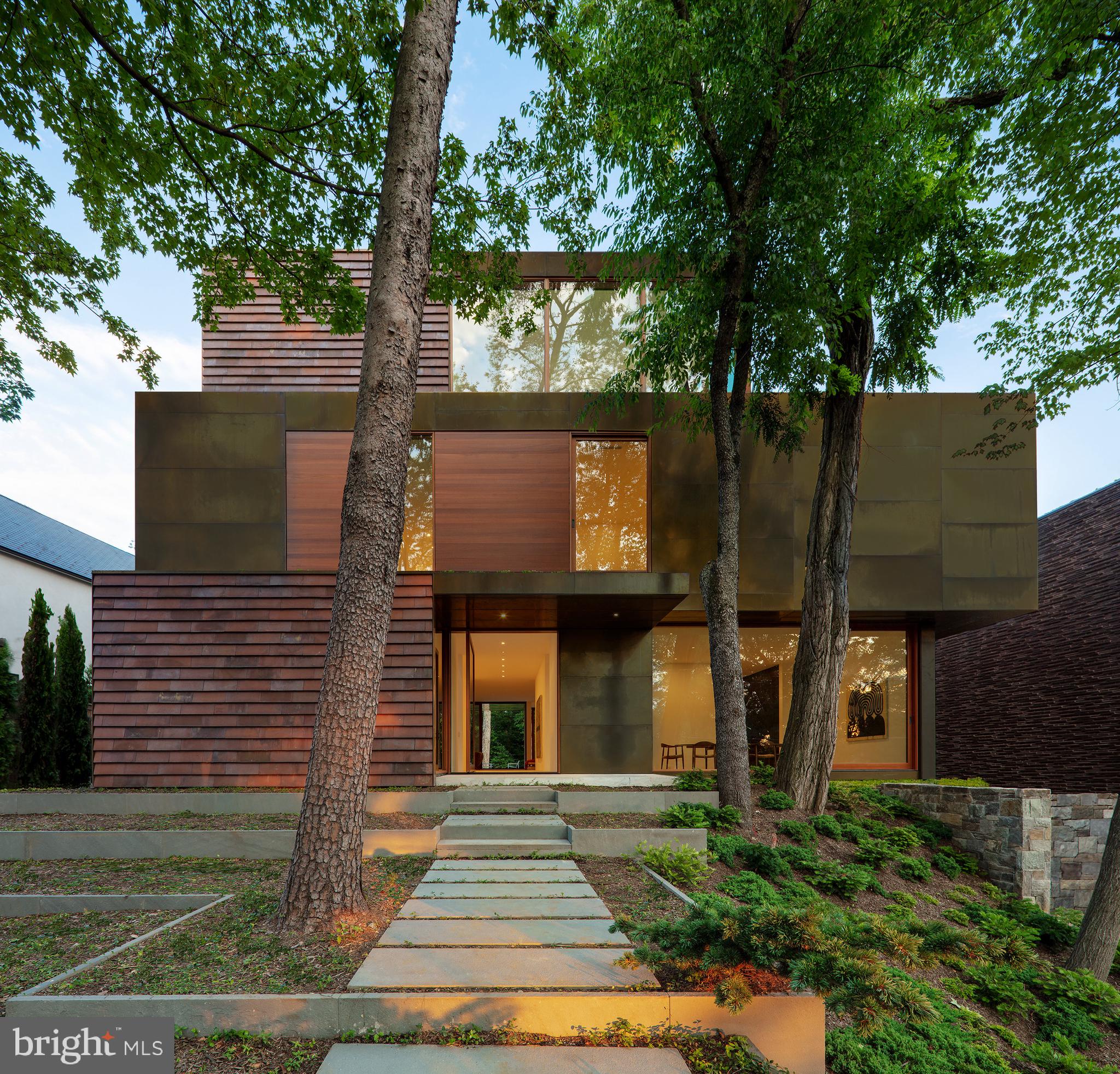 3131 Chain Bridge Road Northwest Washington, DC 20016 - Photo 2 of 54 front view of a house with a yard