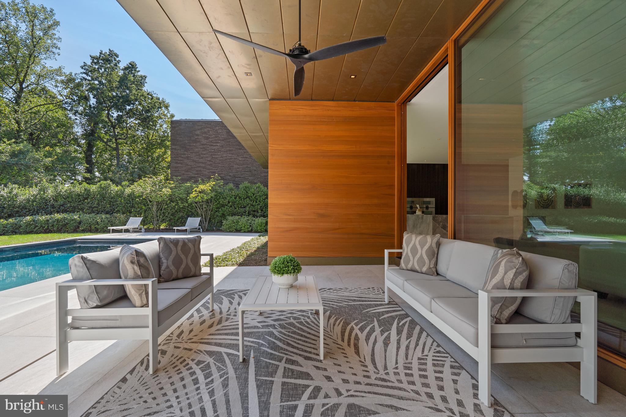 3131 Chain Bridge Road Northwest Washington, DC 20016 - Photo 21 of 54 a view of patio with couches and pool