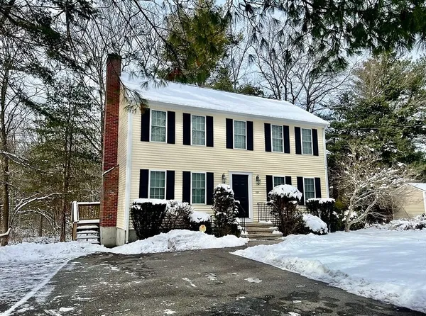 a front view of a house with yard porch and furniture
