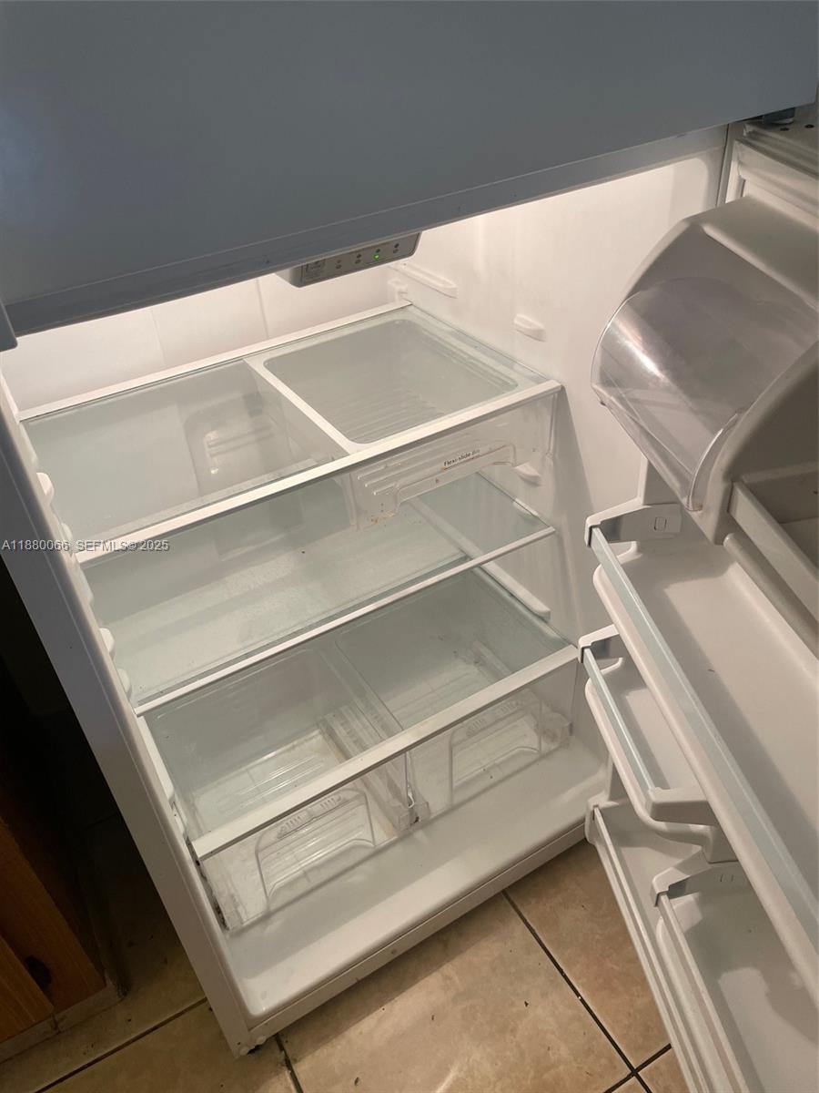 2401 Riverside Drive, Unit 203B Coral Springs, FL 33065 - Photo 25 of 38 Refrigerator