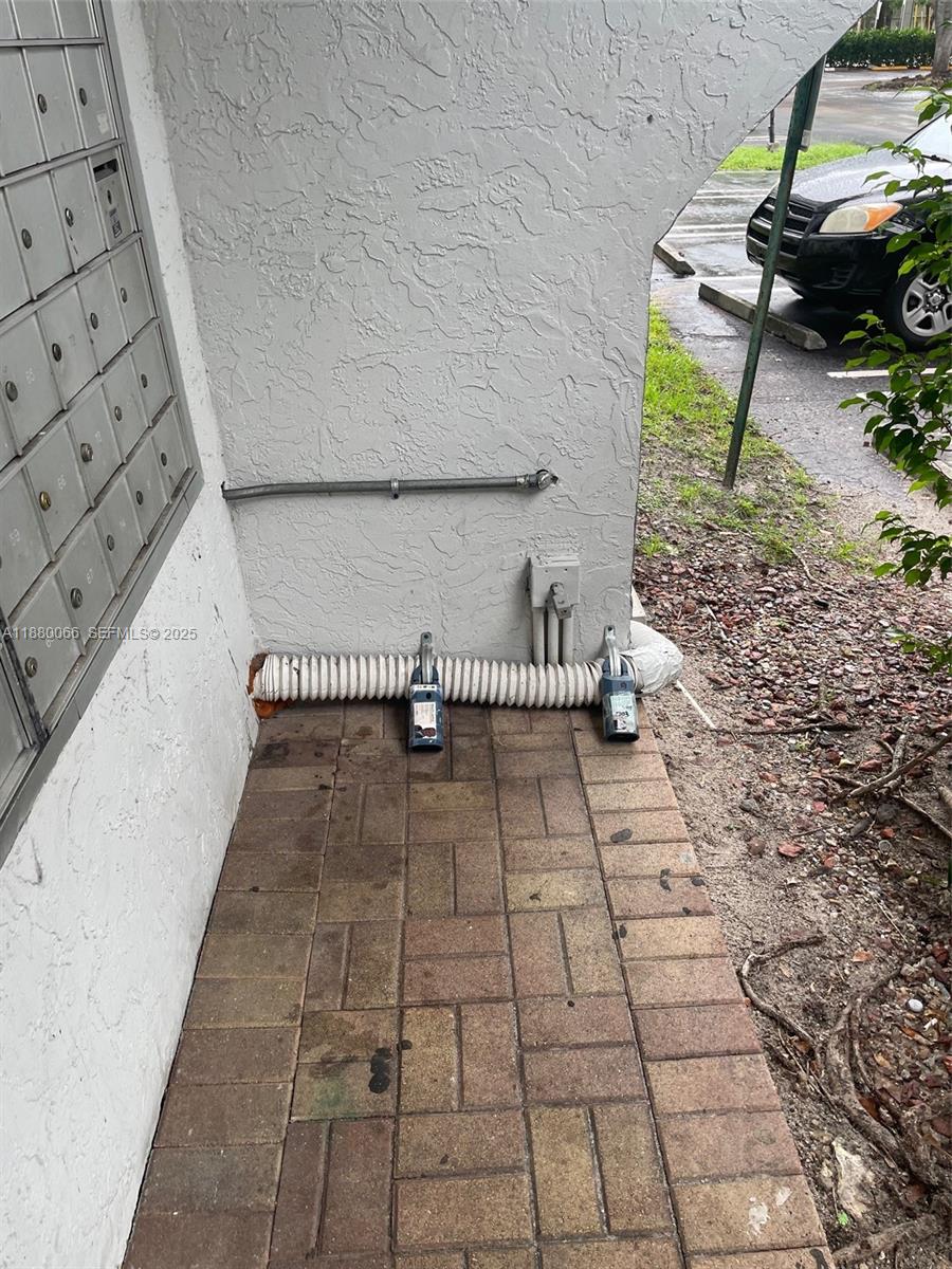 2401 Riverside Drive, Unit 203B Coral Springs, FL 33065 - Photo 37 of 38 Supra Next to the Building Mailbox. # 203 is the Right one.