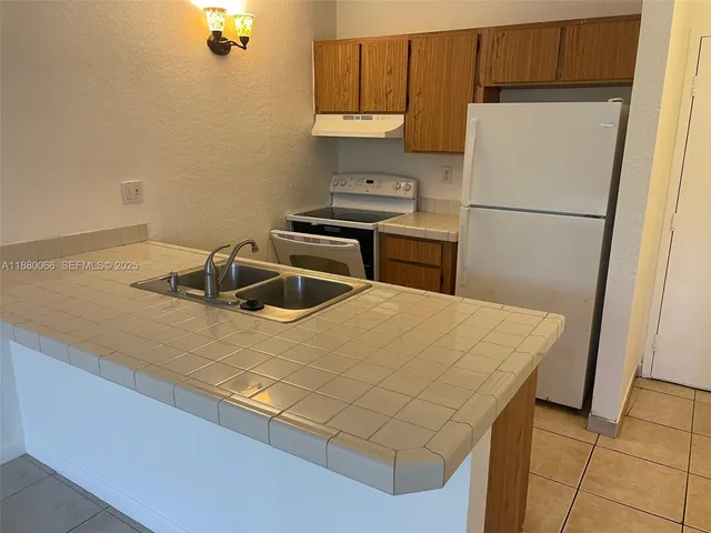 $1,440 | 2401 Riverside Drive, Unit 203B, Coral Springs, FL 33065