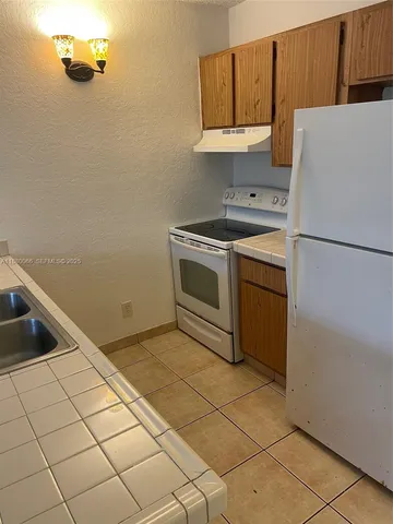 $1,440 | 2401 Riverside Drive, Unit 203B, Coral Springs, FL 33065