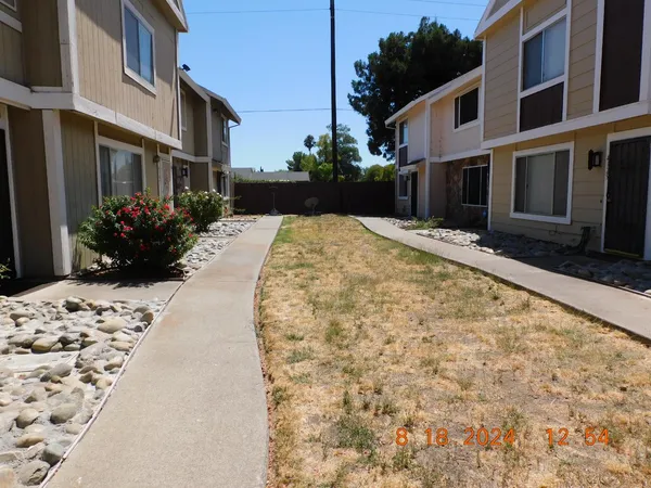 a view of a backyard of the house