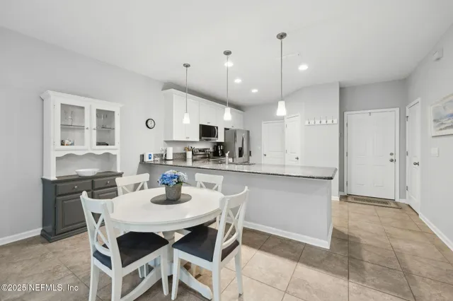 a bathroom with a sink a mirror and shower