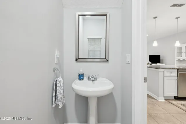 a view of a hallway with white walls