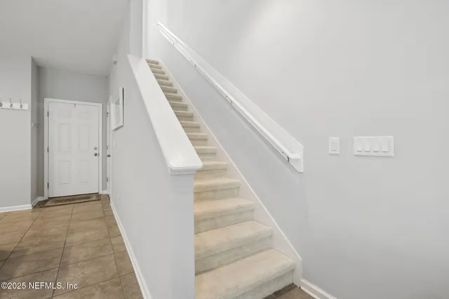 a view of a hallway with wooden shelves