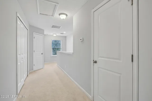 a bedroom with a bed and a ceiling fan