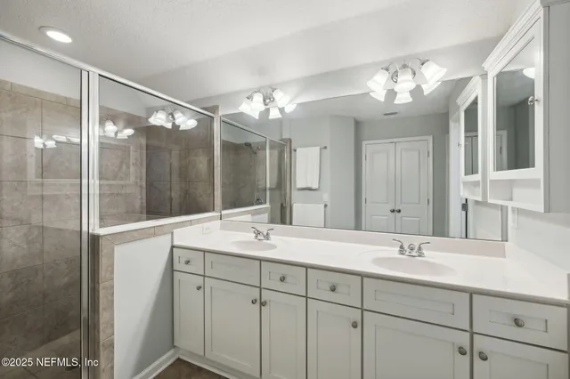 a bedroom with a bed and a wooden floor