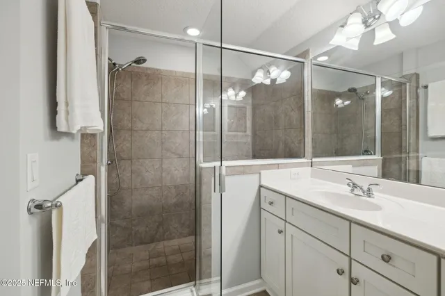 a bedroom with a bed and a shower