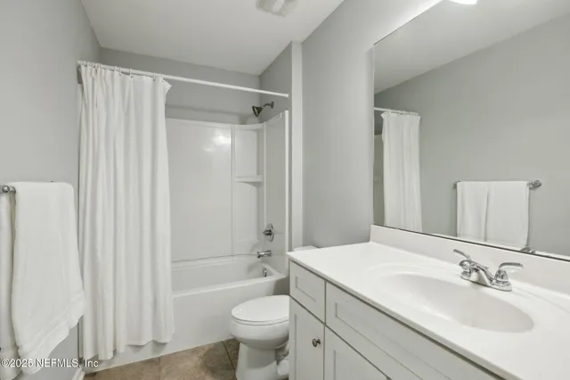 a view of a storage & utility room with two washing machine