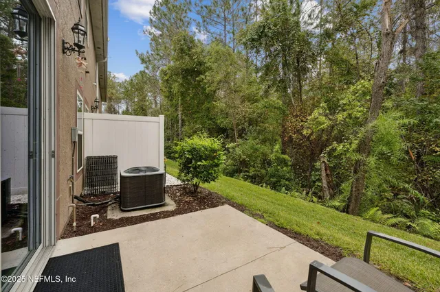 a view of a park with iron fence