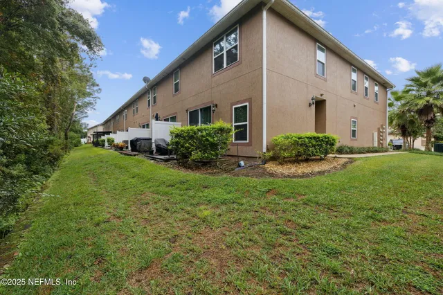 a view of house with a swimming pool